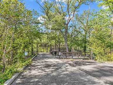 Tree-lined path down to the boat launch